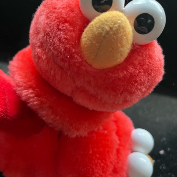 Elmo big kid slippers.  Toddler size large - 9/10.  Gently worn. - Picture 2 of 3